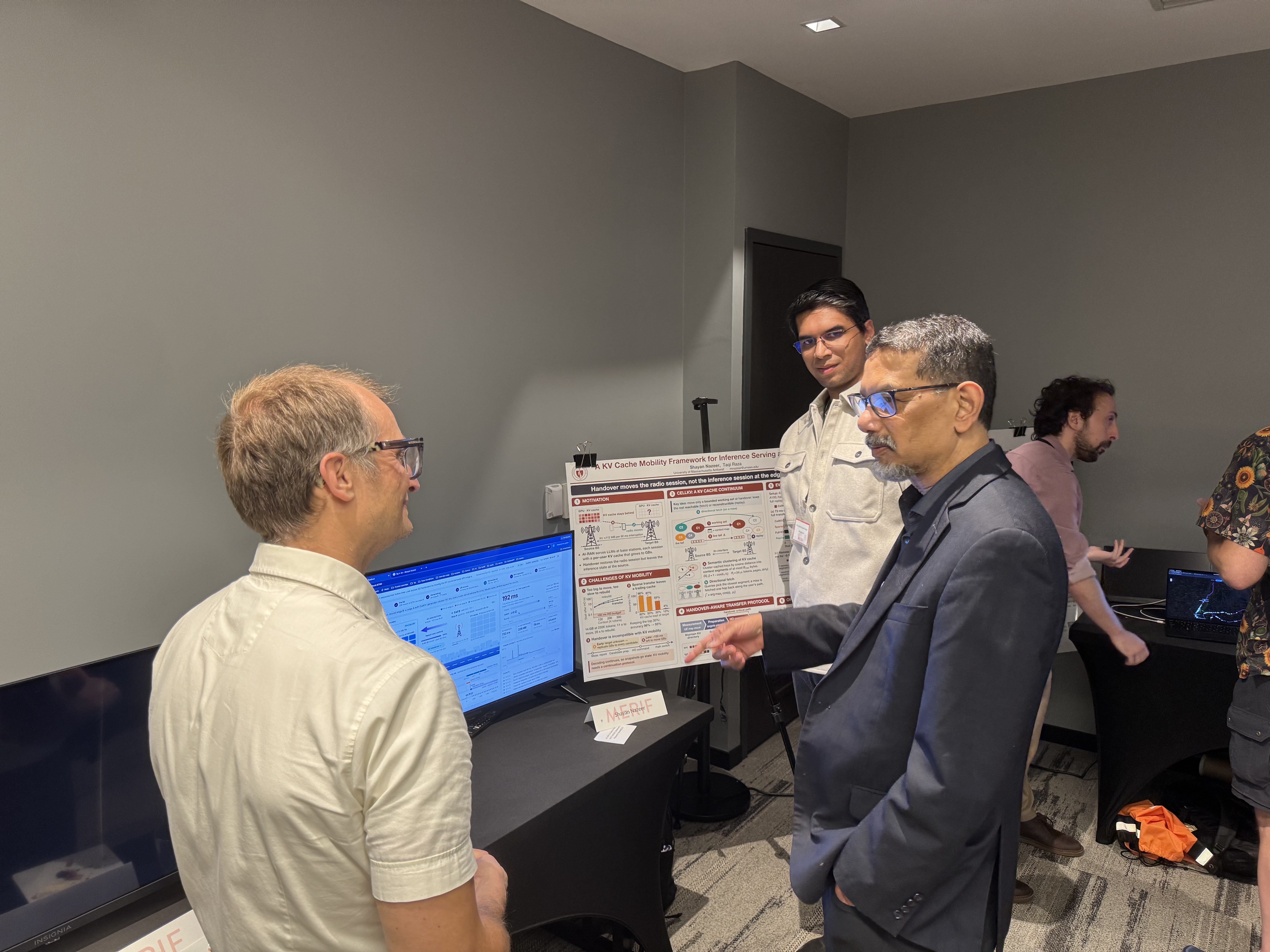 Shayan discusses the poster and demo with attendees at the PAWR and MERIF PI meetings.